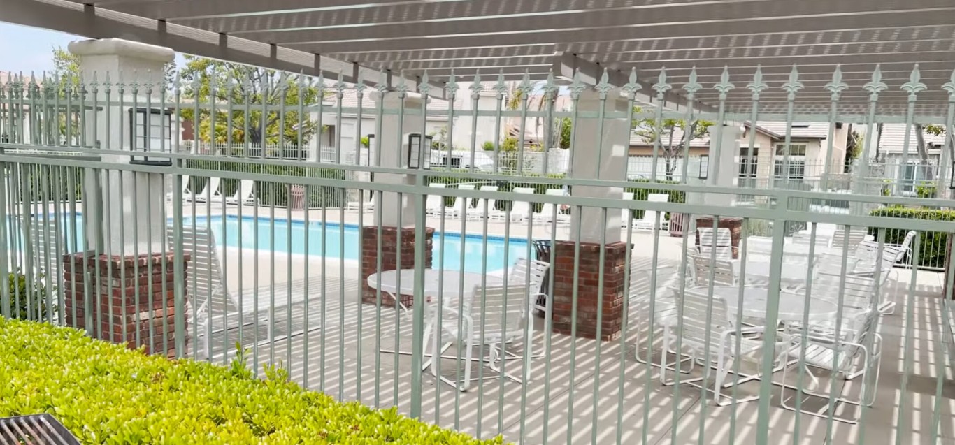 Affordable aluminum pool fence protecting residential property